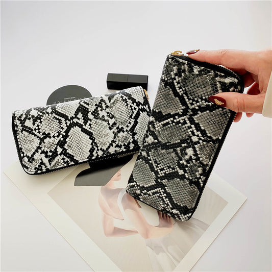 Snake print zipper clutch